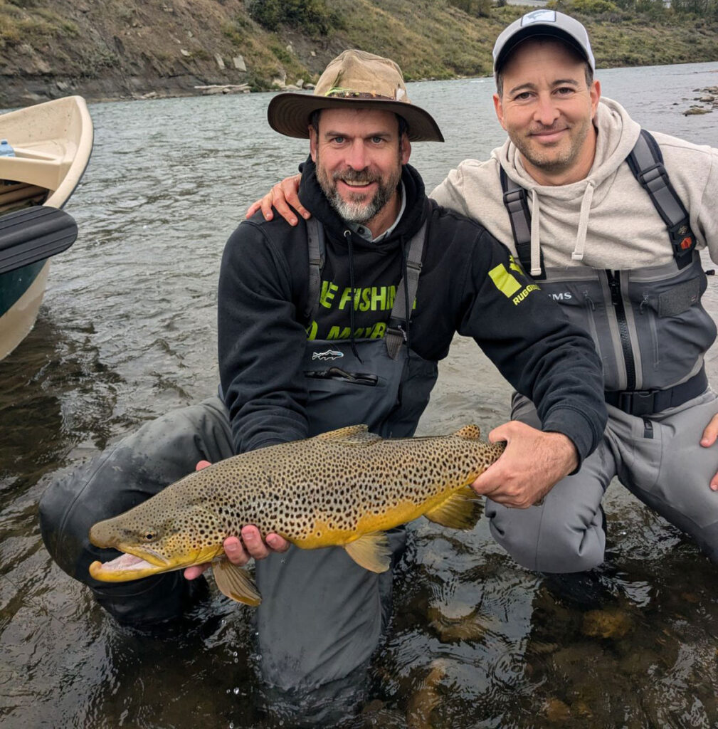 Fly Fishing Guide Fraser with large trout on Bow River